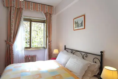 a bedroom with a bed and a window at The Condottieri in Rome