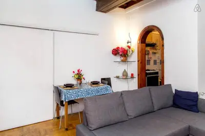 a living room with a couch and a table at Centro Storico - Piazza di Spagna in Rome