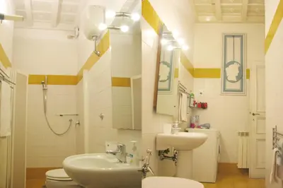 a bathroom with a toilet and a sink at Centro Storico - Piazza di Spagna in Rome