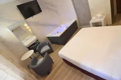 a hotel room with a bathroom with a tub at Hotel Santa Prassede in Rome