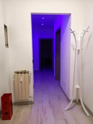 a hallway with a purple light in a room at Casa Vacanza Katiuscia in Rome