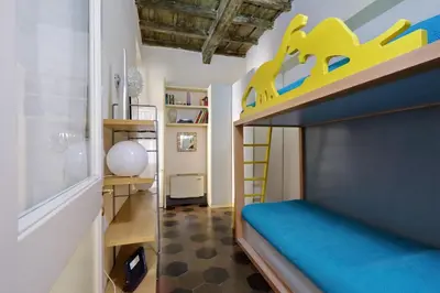 a bedroom with a bunk bed with a toy train on it at Monti Charm by the Colosseum in Rome