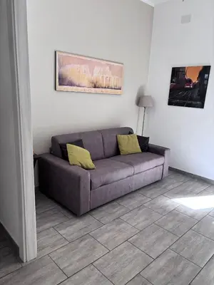 a living room with a couch in a room at Pietro's house in Rome