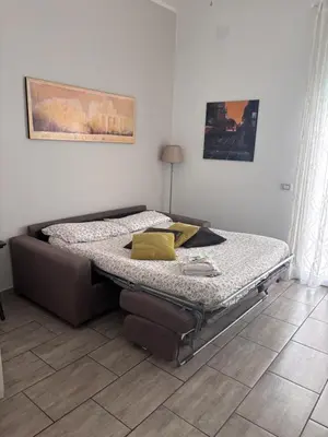 a bed sitting in a room with at Pietro's house in Rome