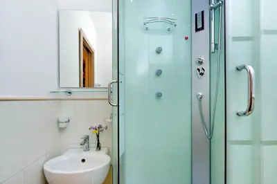 a bathroom with a sink and a shower at Gialli Vatican Guesthouse in Rome