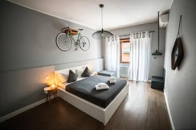 a bedroom with a bed with a bike on the wall at Rhome Vintage Holidays San Pietro in Rome