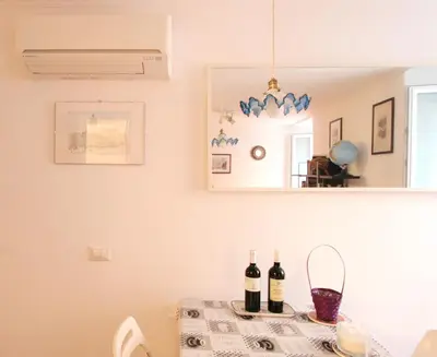 a table with two bottles of wine on it at Roma center Fori Imperiali Raffy's charming Suite in Rome