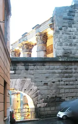 a car parked in front of a stone building at Roma center Fori Imperiali Raffy's charming Suite in Rome
