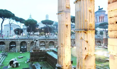 a view of a city from the ruins of a building at Roma center Fori Imperiali Raffy's charming Suite in Rome
