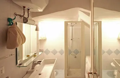 a bathroom with a sink and a shower at Roma center Fori Imperiali Raffy's charming Suite in Rome