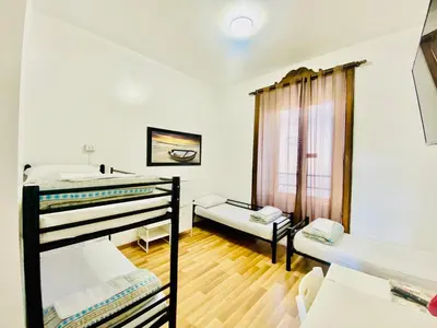 a room with two bunk beds and a window at COMFORT INN ROMA TERMINI in Rome