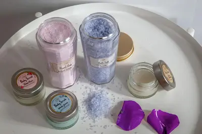 a white plate with four jars of cosmetics on it at Almaìt in Rome