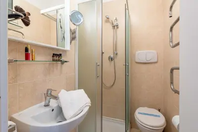 a bathroom with a shower and a sink and a toilet at Sistina House Style HolidayHome x 6 in Rome