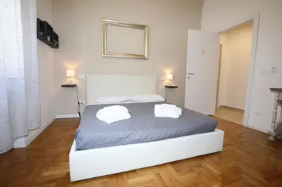 a bedroom with a bed with two towels on it at Unique luxury apartment and rooms in Rome
