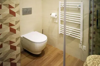 a bathroom with a white toilet in a room at Rome Labicana Apartment in Rome