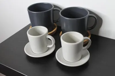 three coffee cups and saucers on a table at Roma suite Piramide in Rome