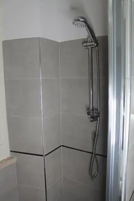 a shower with a shower head in a bathroom at Roma suite Piramide in Rome