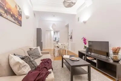 a living room with a couch and a flat screen tv at Daplace - Matilde Apartment in Rome