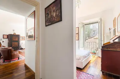 a room with a bedroom with a bed and a piano at R.C. Cappellari Charming Campo de Fiori in Rome