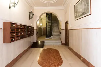 a hallway with a rug on the floor at Horti Sallustiani Roma in Rome