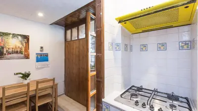 a kitchen with a stove and a counter top at Rental in Rome Scala Deluxe in Rome