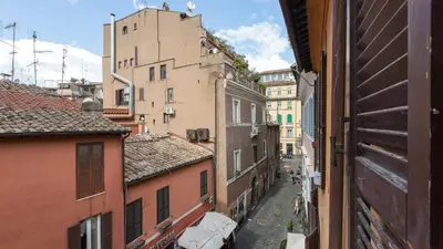 a view of an alley between two buildings at Rental in Rome Trastevere Atmosphere in Rome