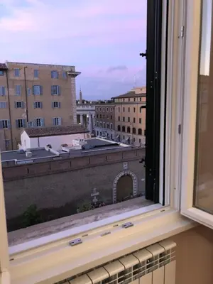 a view of a city from a window at Zeus Inn - Una finestra sul Vaticano in Rome