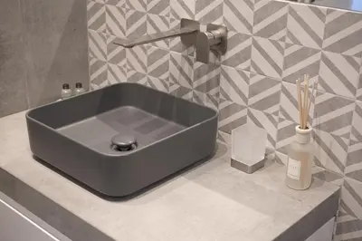 a sink in a bathroom with a counter top at 1 bdr apartments Ambio Suites Luxury Trastevere in Rome