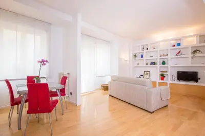 a living room with a table and a couch at Dream House Vaticano in Rome