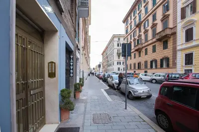 a city street with cars parked on the street at Dream House Vaticano in Rome