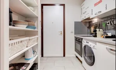 a laundry room with a washer and dryer at CRIS - close to VATICAN - Centre&StadiumArea in Rome