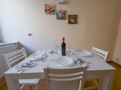 a room with a table and a mirror on the wall at Pandy Suite in Rome