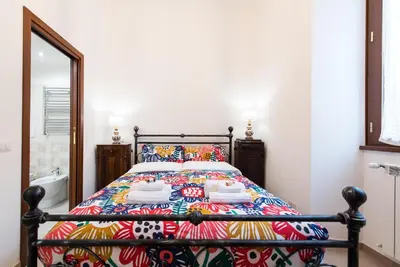 a bedroom with a bed with a colorful bedspread at Circus Maximus n 1-at 400m Metro in Rome