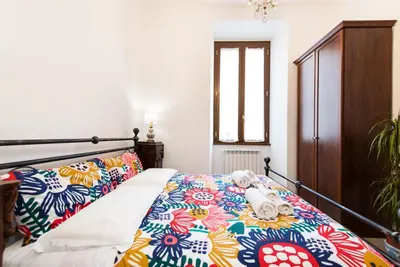 a bedroom with a bed with a colorful bedspread at Circus Maximus n 1-at 400m Metro in Rome