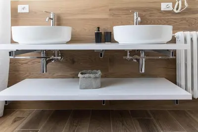 two sinks in a bathroom with wooden walls at *****AmoRhome***** New Luxury apartment in the heart of Rome in Rome