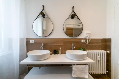 two sinks in a bathroom with two mirrors at *****AmoRhome***** New Luxury apartment in the heart of Rome in Rome
