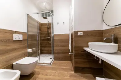 a bathroom with a shower and a toilet and a sink at *****AmoRhome***** New Luxury apartment in the heart of Rome in Rome
