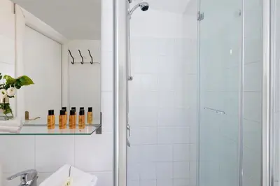 a bathroom with a shower and a sink at Grotte Apartment near Campo dé Fiori in Rome