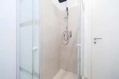 a shower with a glass door in a bathroom at Casa Bella Pantheon in Rome
