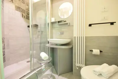 a bathroom with a shower and a toilet and a sink at Design&Art Pie' - Elegant Rooms Near the Pantheon, Calm & Central Stay in Rome
