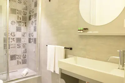 a bathroom with a shower toilet and a sink at Design&Art Pie' - Elegant Rooms Near the Pantheon, Calm & Central Stay in Rome