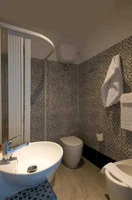 a bathroom with a sink and a toilet at MF Hotel in Rome