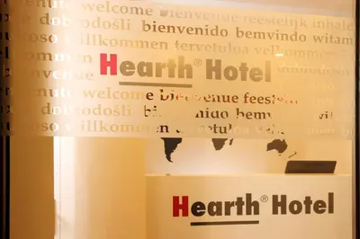 a sign for a heart hotel on a window at Hearth Hotel in Rome