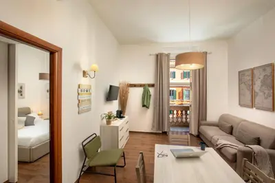 a living room with a couch and a table at Fornaci Vatican Flat in Rome