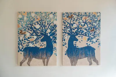 two paintings of two trees with birds on them at St. Peter Central Rooms B&B in Rome