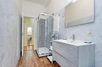 a bathroom with a sink and a shower at AL Holiday Home in Rome