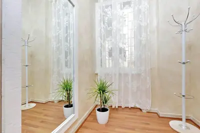 a room with two potted plants and a window at AL Holiday Home in Rome