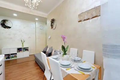 a dining room with a table and chairs at AL Holiday Home in Rome