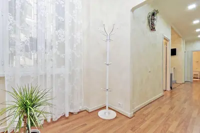 a room with a white wall with a curtain at AL Holiday Home in Rome