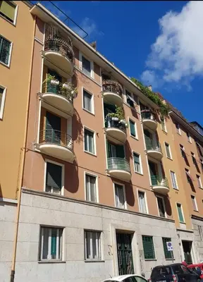 a large building with balconies on the side of it at AL Holiday Home in Rome